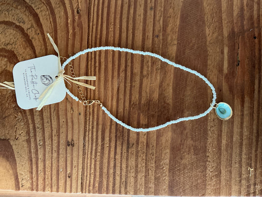 White bead necklace w small oyster